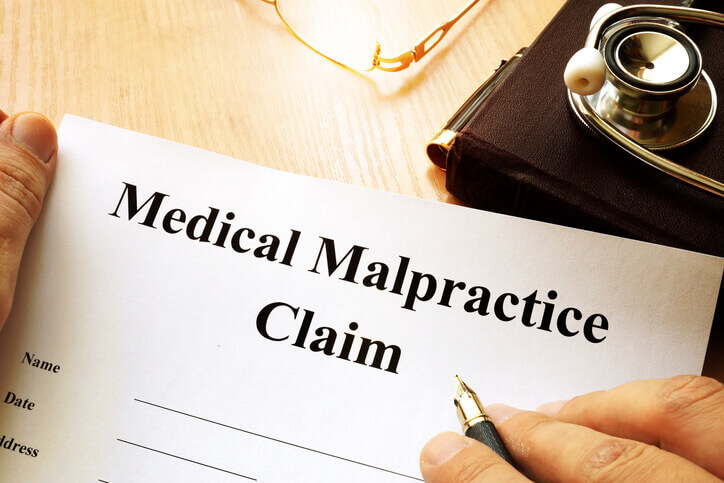 Medical Malpractice Claim on a table