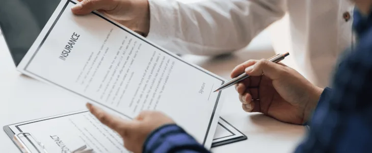 Insurance agent speaking with a car accident client