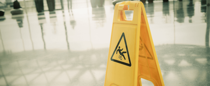 Caution wet floor sign to represent a possible slip and fall.