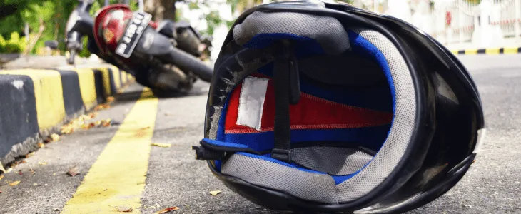 Motorcycle helmet on the road after an accident