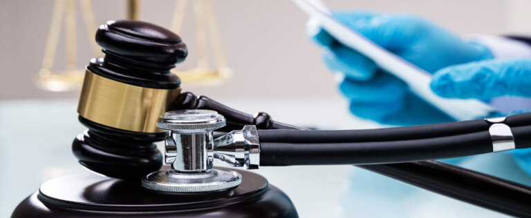 Medical Malpractice Litigation. Lawyer Or Judge In Courtroom