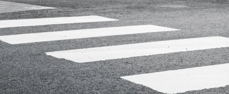 Empty crosswalk to represent potential pedestrian accidents in Syracuse